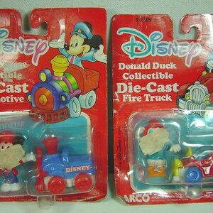 2 Arco Mattel Disney diecast toys-unopened packages-fire truck & locomotive